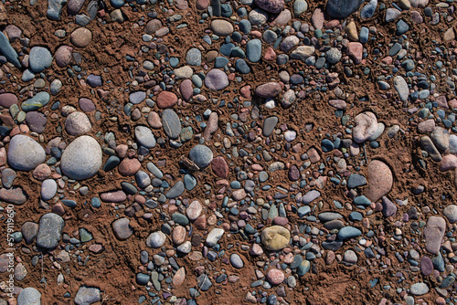 Small stones on dried riverbed photo