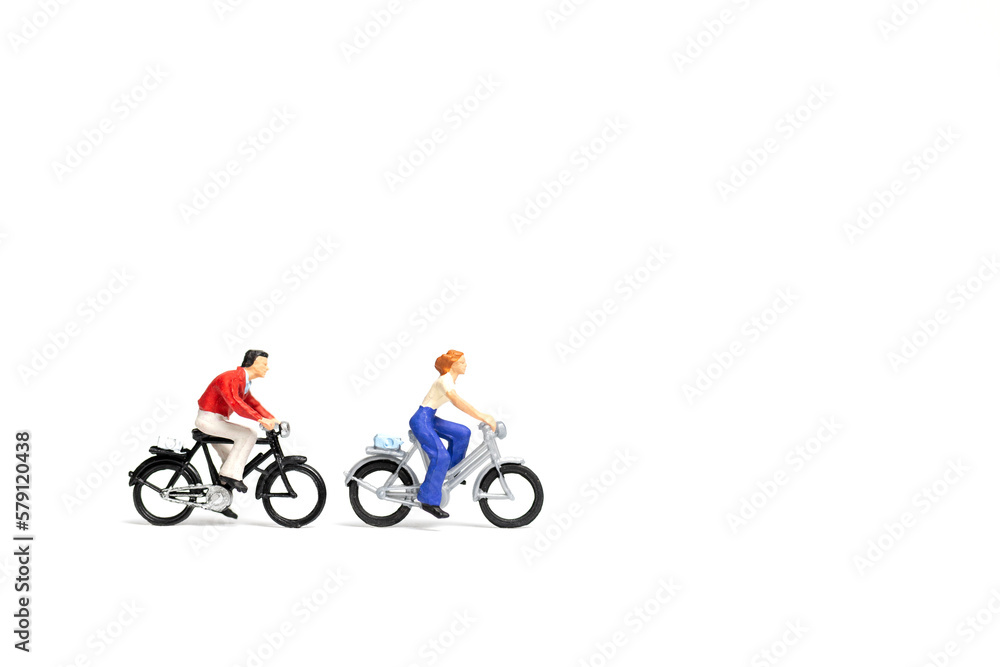 Miniature people : Couple ride bicycle on white background , Miniature people : Couple ride bicycle on white background ,