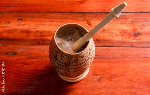 Nicaraguan cocoa drink in artisan jícara. Nicaraguan cocoa drink served in a traditional gourd. Concept of traditional drinks from Nicaragua and latin america photo