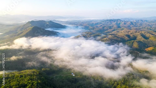 Aerial fly drone hyperlapse foggy or the clouds while sunrise sky, sea of mist mount nature.