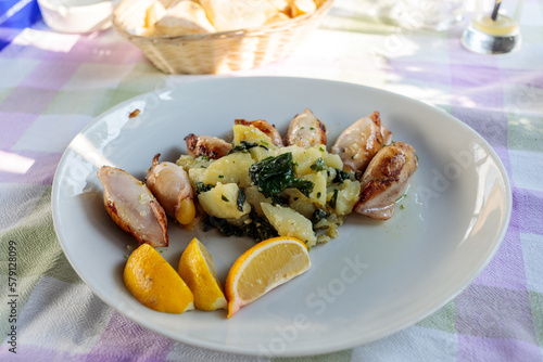 Seafood: Squids stuffed with shrimps served with potatoes served in Sutomore, Montenegro