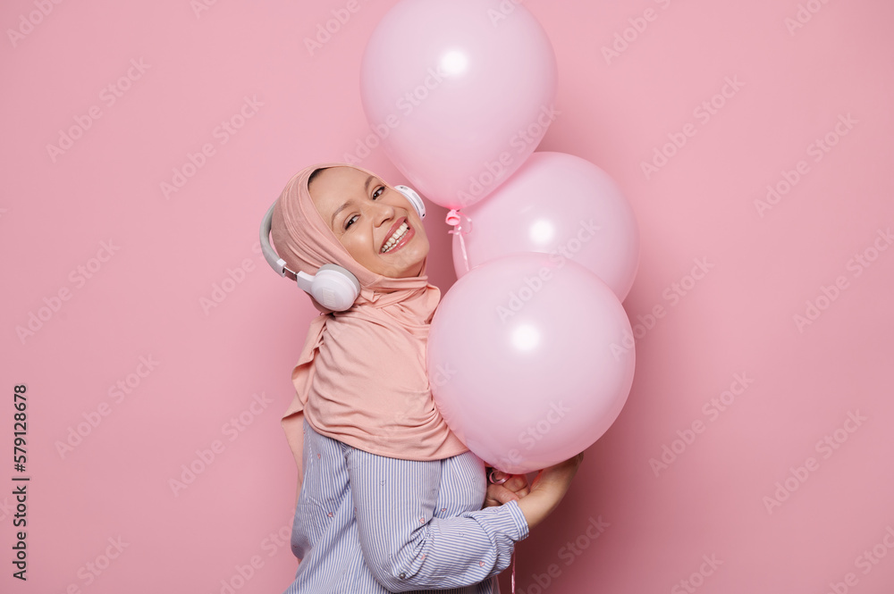 Attractive glamour Middle-Eastern Muslim woman in a pink hijab and ...