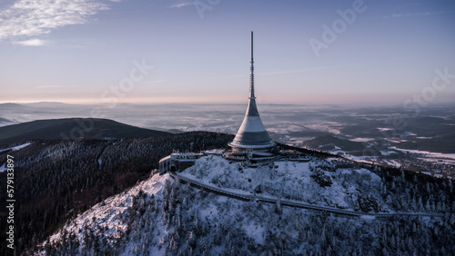 A bird's eye view of snow-covered Jested at sunrise. Photographed on the Jested ridge by drone. Beautiful winter landscape in Liberec region. photo