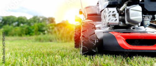Obraz na plátně lawn mower on a green mown lawn