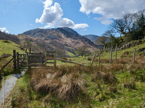 View of little Langdale near the lake Coniston in background of mountains, landscape with fence