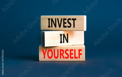 Invest in yourself symbol. Concept words Invest in yourself on wooden block on a beautiful grey table grey background. Business and Invest in yourself concept. Copy space. © Dzmitry