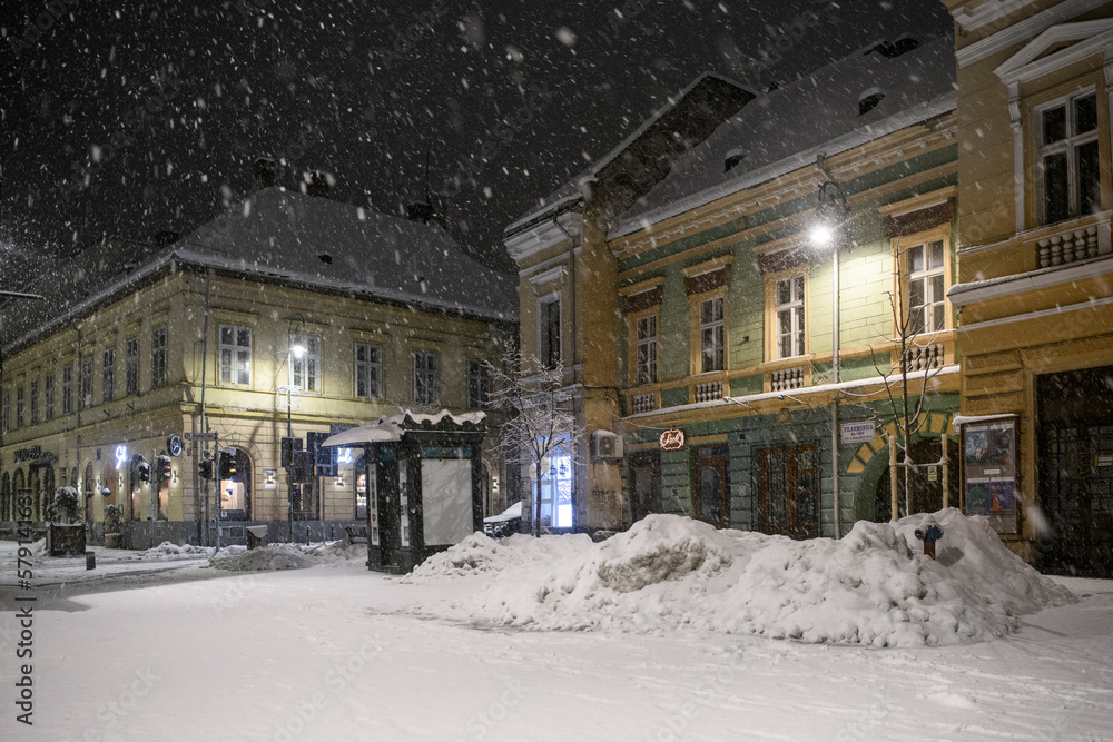 Fototapeta premium Brasov, Romania - Winter night in the historical old town of Brasov, Transylvania