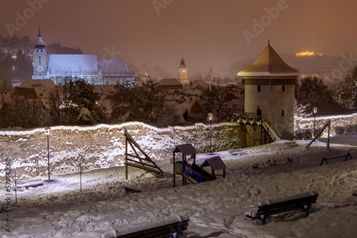 Brasov, Romania - Winter night in the historical fortress and walls of Brasov, Transylvania photo