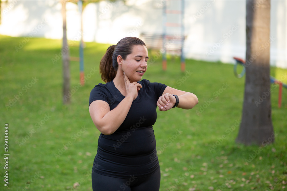 Sport woman doing exercise in a park with black clothes Sport woman doing exercise in a park with black clothes