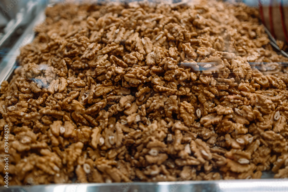 Heap of fresh raw walnut kernels in the market. Heap of fresh raw walnut kernels in the market.