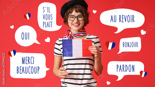 Photos Pretty young woman with flag of France on red background