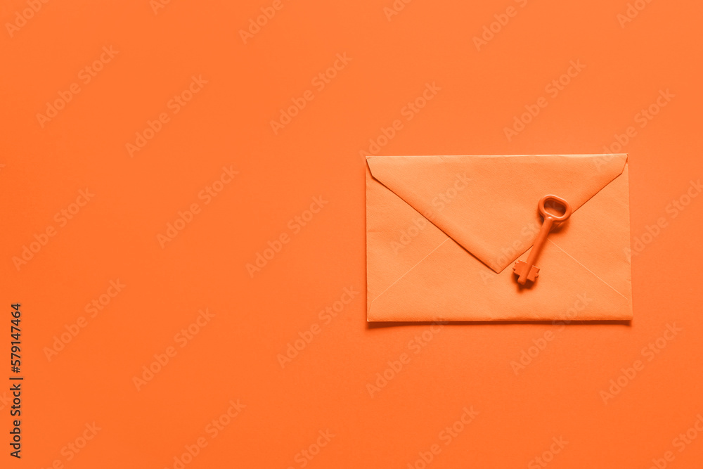 Envelope with key on orange background - obrazy, fototapety, plakaty 