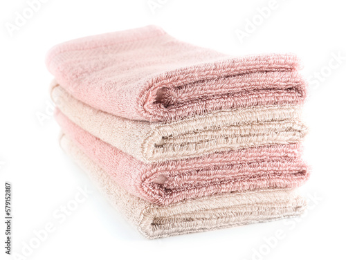 Stack of folded soft towels isolated on white background