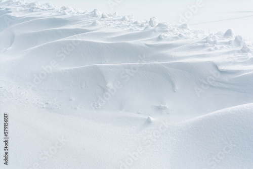 Fototapeta Naklejka Na Ścianę i Meble -  Abstract snow texture background. Close up snow dunes lines. Snowdrift nature background