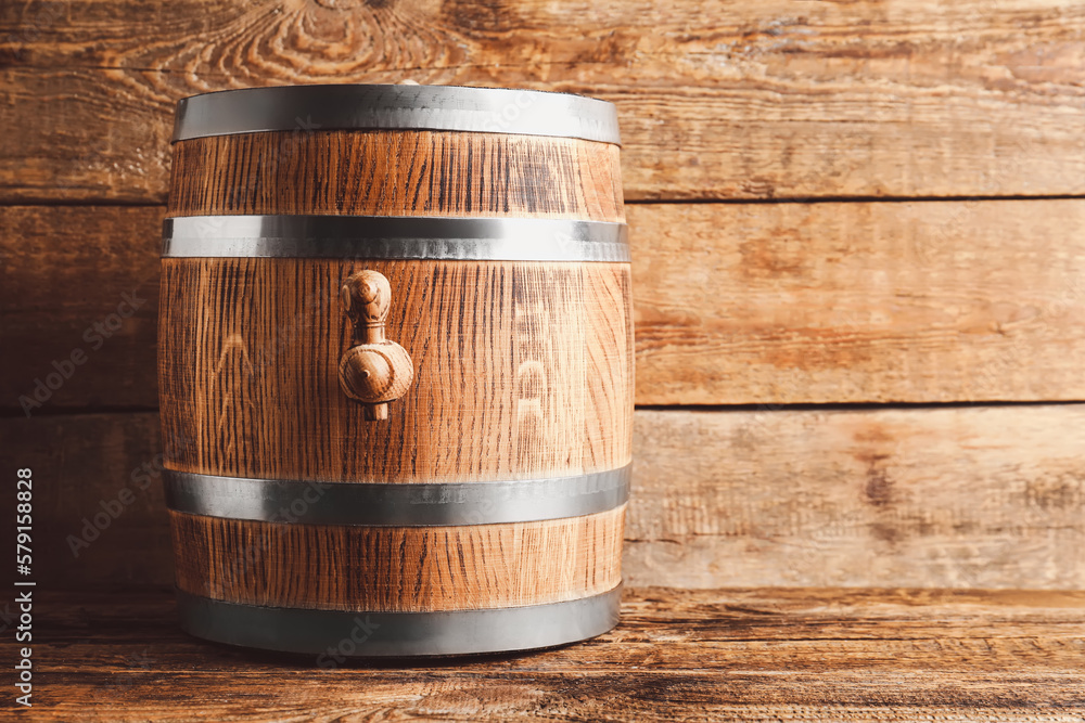 Oak barrel on wooden background