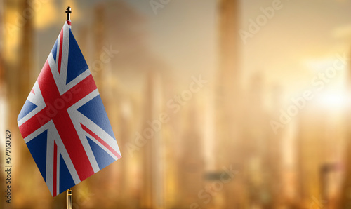 Small flags of the United Kingdom on an abstract blurry background