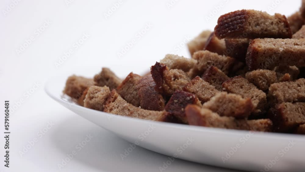 Rye Crackers In A White Plate. Bread Crispy Crackers. Breadcrumbs. Close Up. Panning Dolly Slider Shot. Close Up. 4k, 60 FPS, ProRes Rye Crackers In A White Plate. Bread Crispy Crackers. Breadcrumbs. Close Up. Panning Dolly Slider Shot. Close Up. 4k, 60 FPS, ProRes