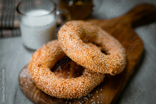 Bakery shop products - various kinds of baguette, bagel, donut, croissant, rolls, bread, puff pastry, powdered sugar delicious pies. Neutral background. Food from bakeries.