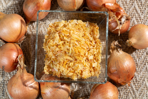 Dried yellow frakes of onion, asian cuisine, close up photo