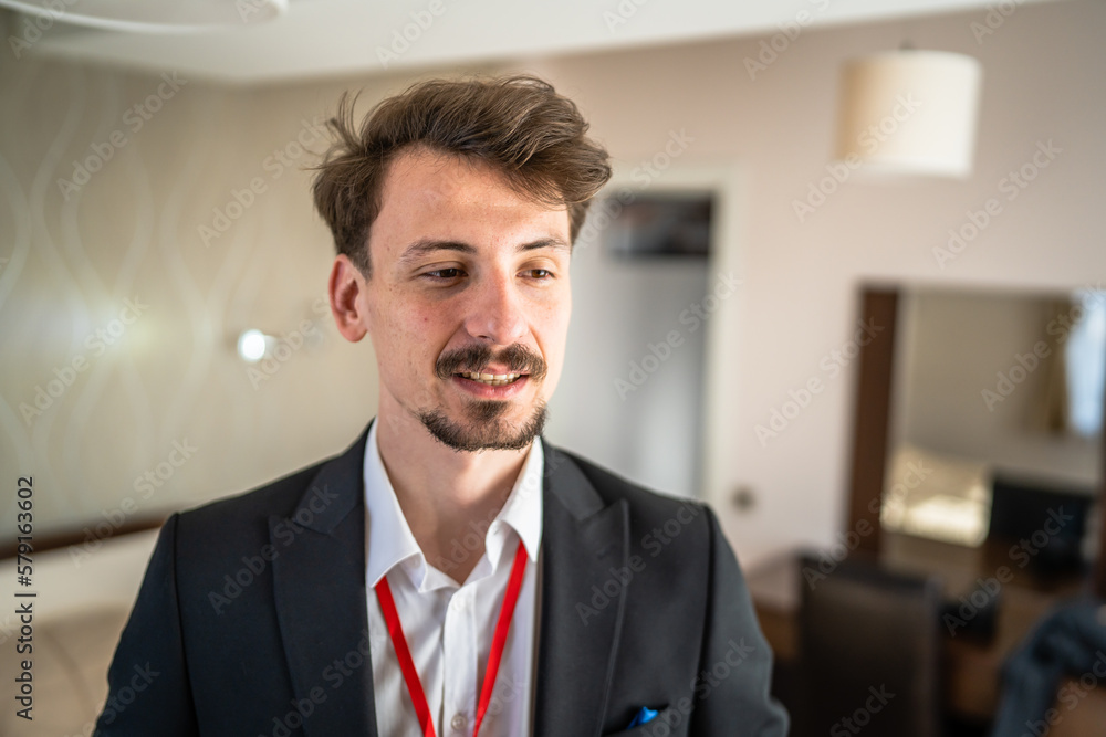 One man caucasian male adult stand in hotel room One man caucasian male adult stand in hotel room