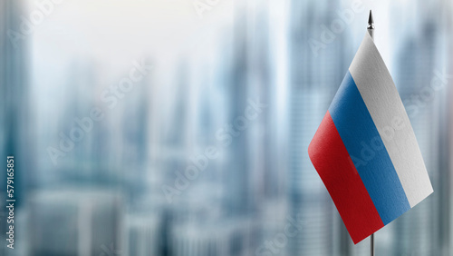 Small flags of the Russia on an abstract blurry background