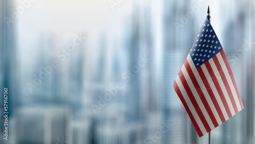 Small flags of the USA on an abstract blurry background