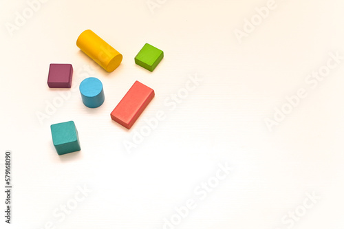 Multicolored wooden figures of different shapes. concept. empty space,