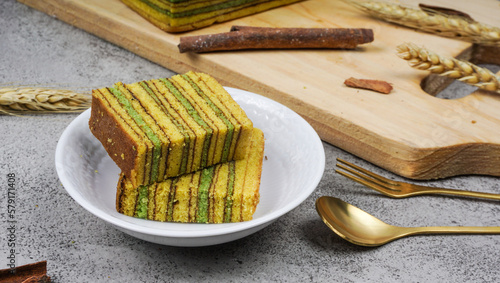 Spekkoek (kue lapis legit or spekuk in Indonesian). it served on white plate