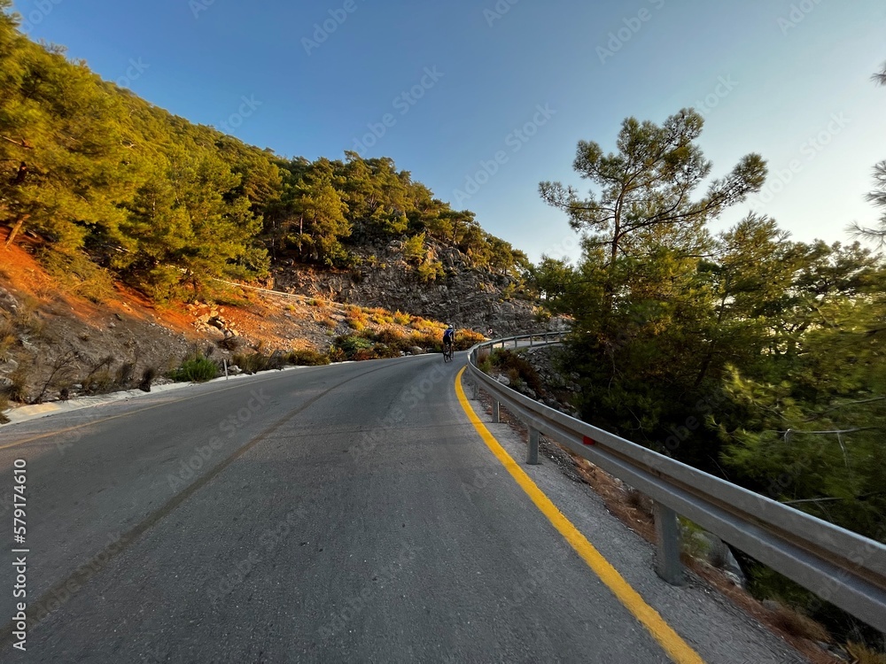 Fototapeta premium road in the mountains with cycler