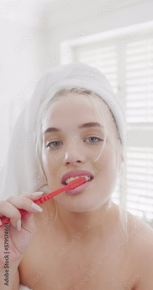 Vertical video of portrait of happy caucasian plus size woman brushing teeth in slow motion Vertical video of portrait of happy caucasian plus size woman brushing teeth in slow motion
