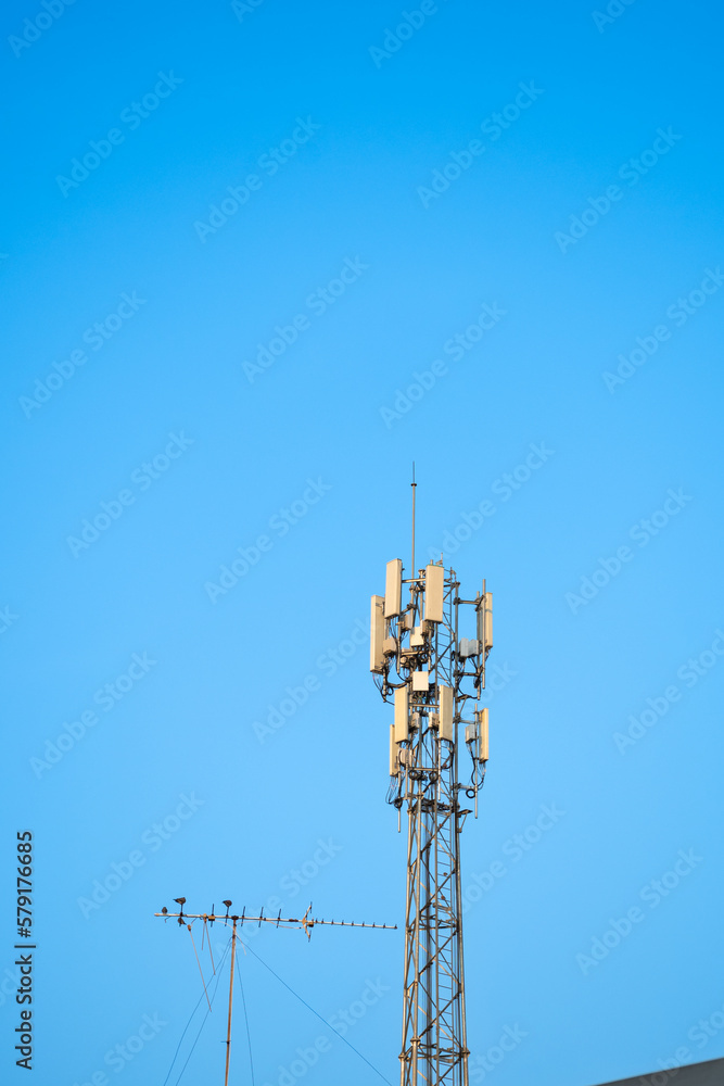 high radio tower againt blue sky high radio tower againt blue sky