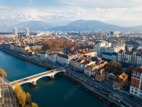 Panoramic aerial view of Grenoble city with bridge over Isere river, France