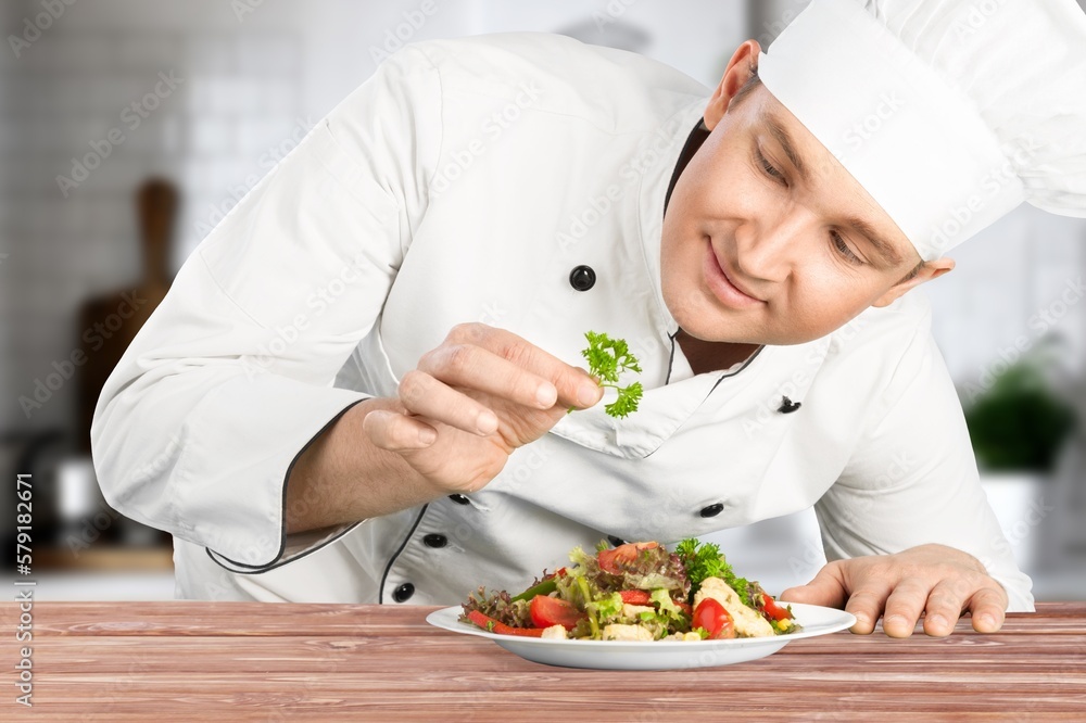 food cooking, professional male chef serving plate food cooking, professional male chef serving plate
