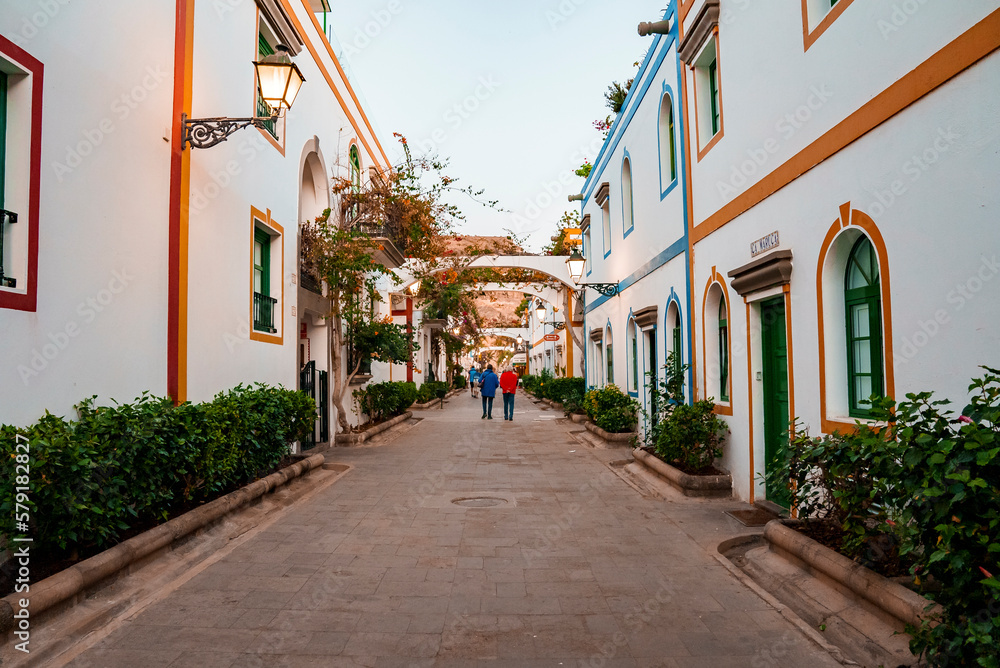 Fototapeta premium Puerto de Morgan alley with white residential buildings on both side at Gran Canaria, Spain