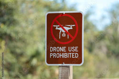 Signpost with warning about drone usage prohibition in state park. Warning notice against using UAV and quadcopters