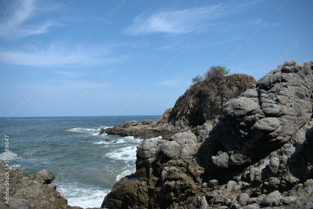 View of rocks over the sea in sunny day View of rocks over the sea in sunny day