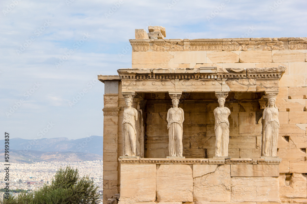 The Erechtheion or Temple of Athena Polias, the Ancient Greek temple at the Acropolis in Athens. The columns that support the porch are six female figures.