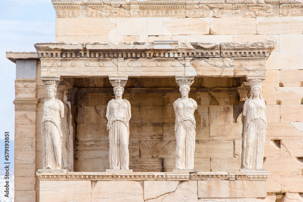 The Erechtheion or Temple of Athena Polias, the Ancient Greek temple at the Acropolis in Athens. The columns that support the porch are six female figures. The Erechtheion or Temple of Athena Polias, the Ancient Greek temple at the Acropolis in Athens. The columns that support the porch are six female figures.