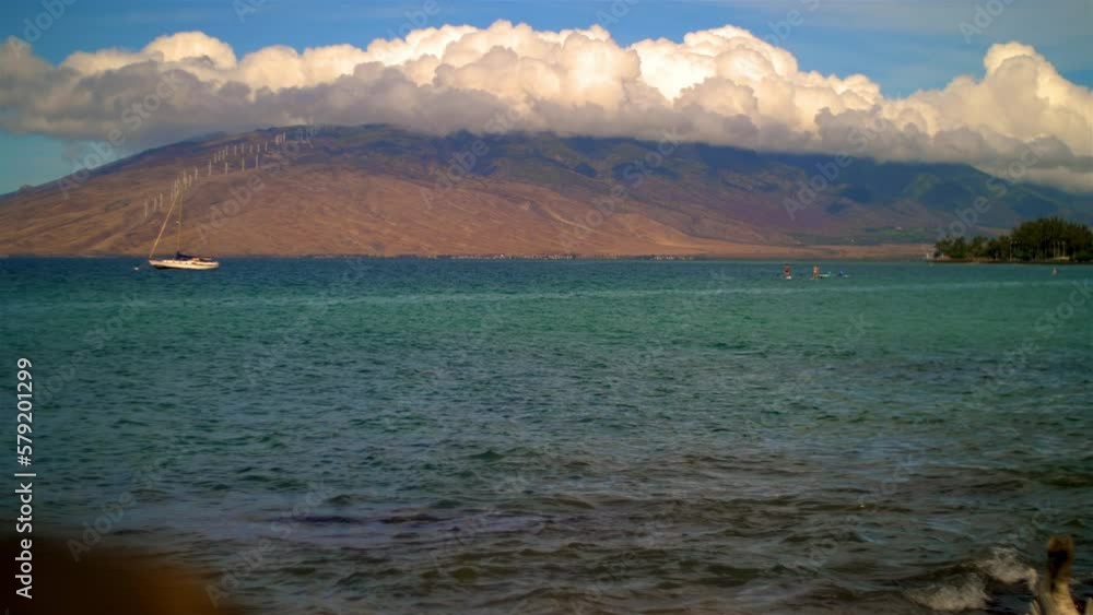 Hawaii distant boat mountains and paddle boarders slow motion Hawaii distant boat mountains and paddle boarders slow motion