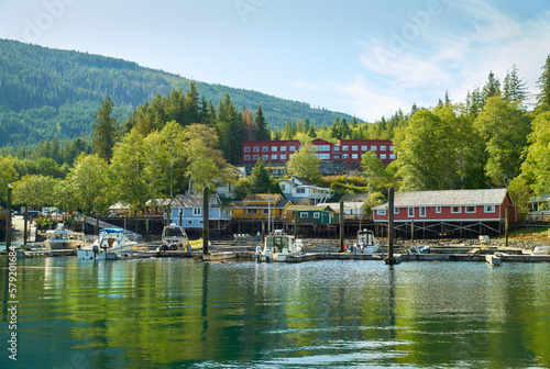 Telegraph Cove Reflections. The Telegraph Cove marina and accommodations built on pilings surrounding this historic location.