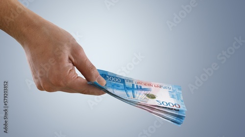 Human hand holding money banknote photo