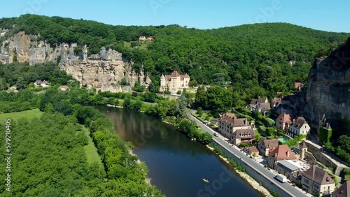 Smooth 4K footage heading up the river in La Roque-Gageac, which is is a commune in the Dordogne department in Nouvelle-Aquitaine, southwestern France. photo