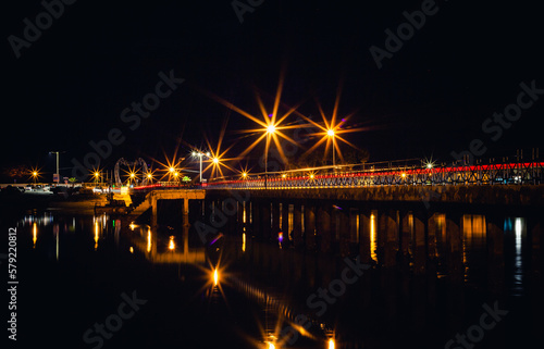view of the Faro beach bridge in Algarve at night 