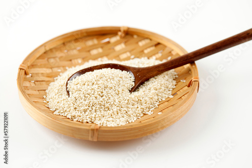 Peeled White Sesame Seed on Bamboo Plate photo