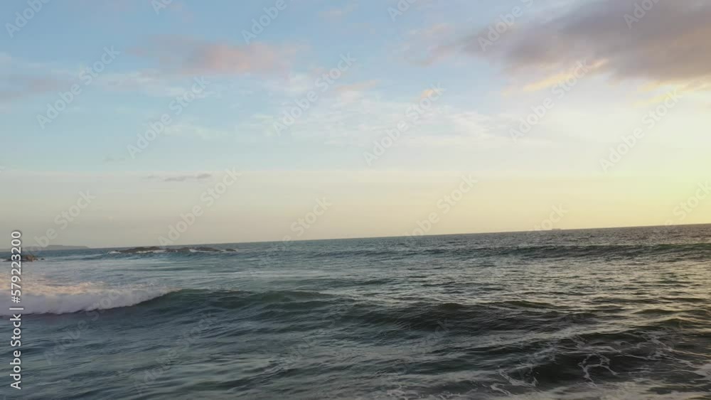 Drone flyover of ocean as waves cresting Drone flyover of ocean as waves cresting