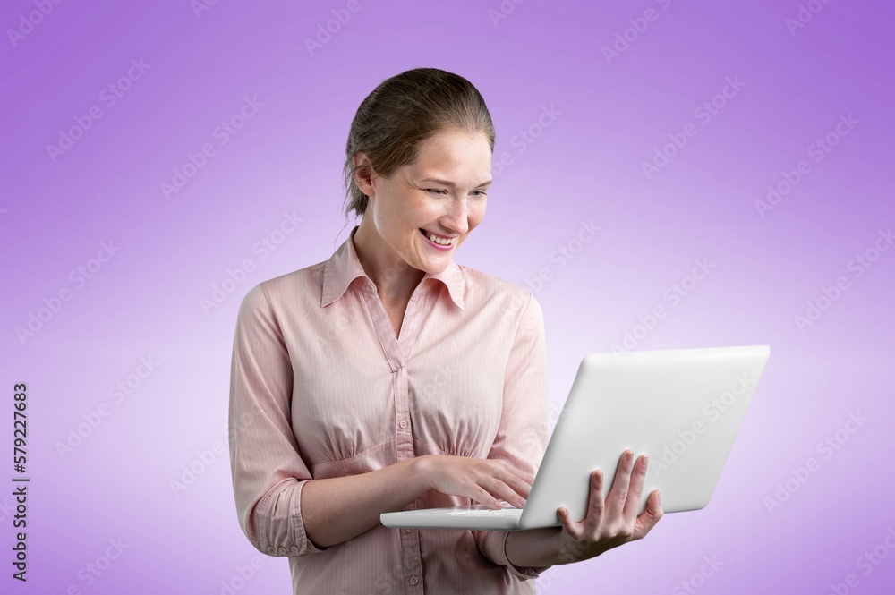 Young business woman holding laptop Young business woman holding laptop
