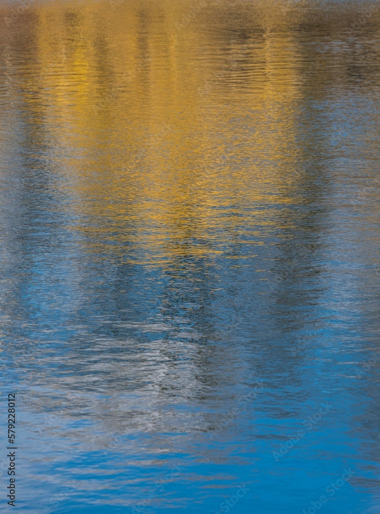 abstract yellow and blue reflection in water