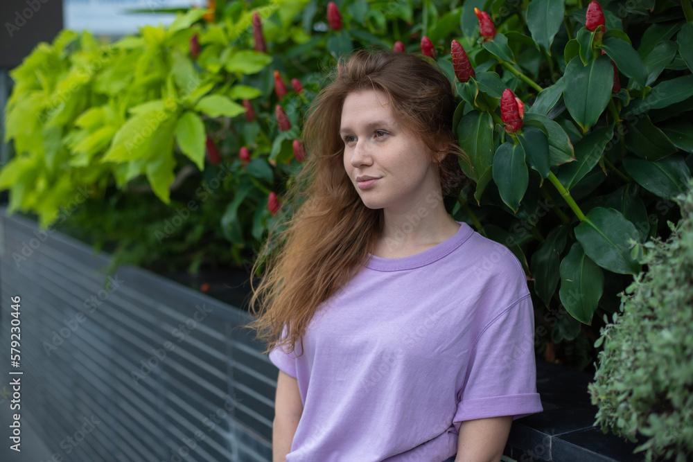 portrait of young girl on a green, natural background, eco friendly woman in a tropical park or jungle, positive lady enjoys walk at garden at summer day portrait of young girl on a green, natural background, eco friendly woman in a tropical park or jungle, positive lady enjoys walk at garden at summer day