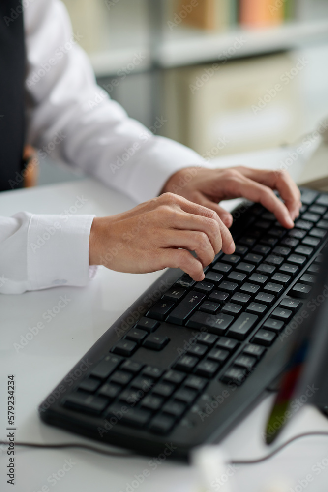 Hands of social consultant typing on keyboard Hands of social consultant typing on keyboard