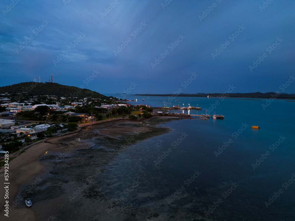 Aerial sunset showing the beach and town of Torres Strait islands